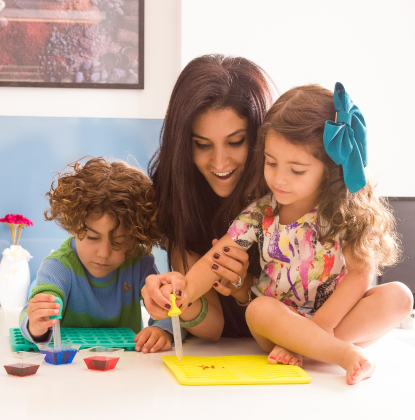 Image of a mother making gummy bears with her son